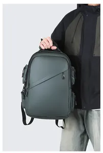 Waterproof business backpack with multi-layer zipper pockets shown by a male model