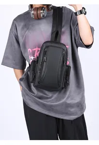 Detail of waterproof black men's chest bag with adjustable strap and smooth zippers
