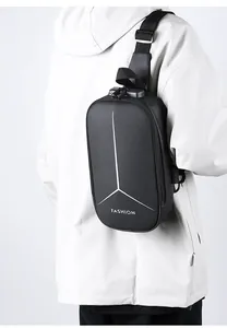 Close-up of black hard shell anti-theft chest bag with fashion print and adjustable strap