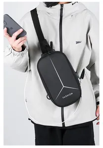 Detail view of anti-theft combination lock and USB charging port on hard shell chest bag