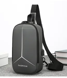 Detail of grey waterproof sling bag featuring security lock and external USB charging port