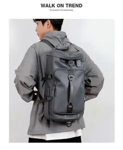 Dark gray waterproof backpack for men shown on model with multiple storage compartments