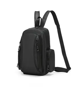 Detail view of the multi-pocket structure and waterproof matte fabric on the black backpack