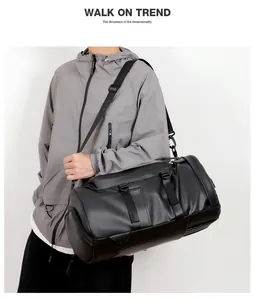 Macro detail of black waterproof travel duffel with adjustable straps and side zip pocket