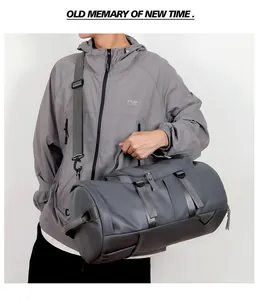 Detail view of large travel bag with waterproof grey fabric and adjustable shoulder strap