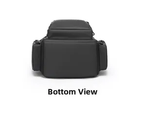 Detailed bottom view of black waterproof backpack showing sturdy nylon fabric and side pockets