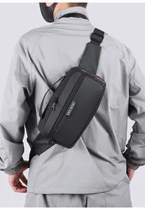 Rear view of model wearing a black nylon crossbody sling bag with adjustable strap