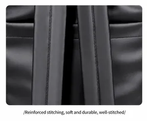 Macro view of reinforced stitching on thick black faux leather travel backpack straps