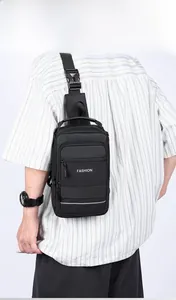 Detailed view of men black waterproof nylon chest bag with adjustable shoulder strap