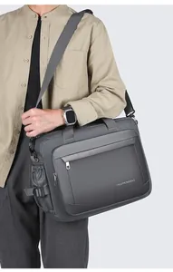 Detail of waterproof nylon business laptop bag with reinforced handles and side pocket
