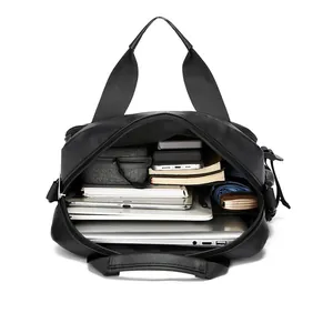 Interior view of black nylon travel bag showing laptop and organized storage compartments