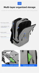 Detail view of large capacity main compartment and multi-layer storage in grey business backpack