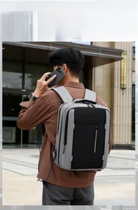 Detail of grey laptop backpack with USB charging port and large capacity storage compartments