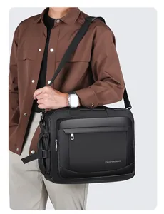 Side view of a black nylon waterproof business commuter bag with shoulder strap