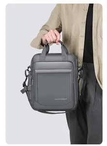 Detail of water-resistant gray business bag featuring durable handles and metal buckles