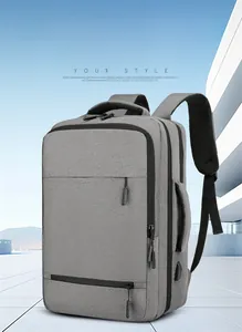 Detail of grey business backpack with side USB charging port and textured fabric finish