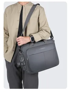 Deep grey business briefcase for men showing size and fit on a male model
