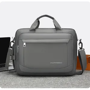 Detail view of water-resistant gray business laptop bag with reinforced handles and strap