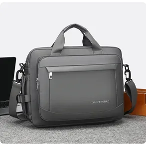 Close-up of dark grey waterproof laptop bag with front zipper pocket and dual handles