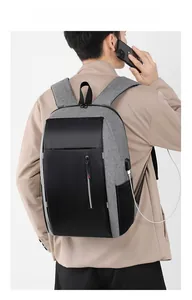 Close-up of business laptop backpack with integrated USB charging port and cable