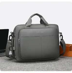 Detailed view of grey business laptop bag with reinforced handles and removable shoulder strap