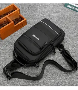 Detail of black crossbody chest bag featuring a digital combination anti-theft lock