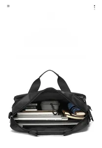 Detailed interior of a black leather business briefcase with multi-compartment storage