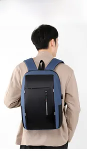 Detail of blue and black business backpack with external USB charging port and zipper