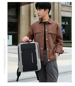 Detail view of water-resistant business laptop backpack with ergonomic straps and gray fabric