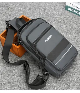 Detailed macro view of the grey water-resistant fabric and zippers on this crossbody bag