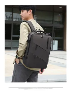 Outdoor view of a dark grey business backpack worn by a model for travel and commuting