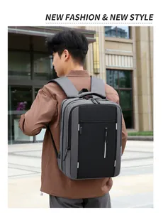 Detailed view of grey travel backpack with USB port and vertical safety reflective strip