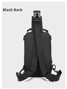 Detail view of the black crossbody bag's back with waterproof fabric and adjustable straps