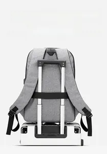 Close-up of the trolley strap on the back of the grey business laptop backpack