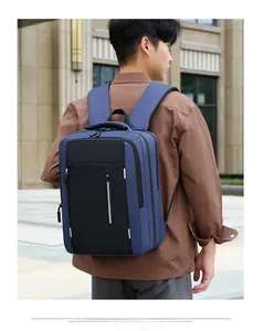 Detail of waterproof business backpack showing ergonomic breathable straps and reflective strip