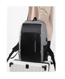 Detail of grey fabric business backpack with integrated USB charging port for travel