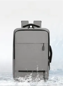 Front view of grey business backpack with waterproof fabric showing water splash resistance