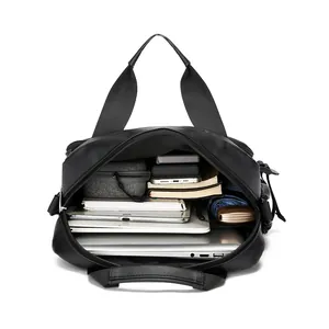 Waterproof black commuter shoulder bag with large capacity for laptop and essentials