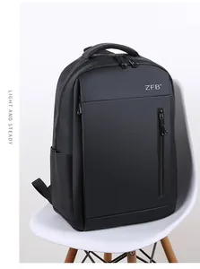 Close-up of black business travel backpack with waterproof texture and metal zipper detail