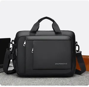 Close-up of black business laptop bag with textured fabric, handles and shoulder strap