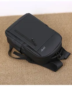 Detail of black waterproof travel backpack with breathable mesh straps and front zipper