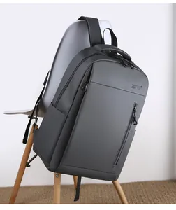 Detail view of water-resistant gray business backpack featuring premium metal zippers