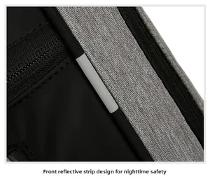 Detail of front reflective strip and durable fabric on grey travel business backpack