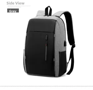 Detail of grey business backpack showing side USB charging port and waterproof oxford fabric