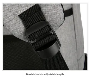 Detail view of the durable strap buckle and adjustable woven strap on a business backpack