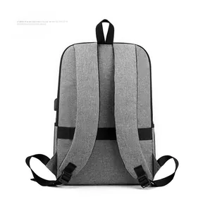 Back view of grey laptop backpack with USB port and luggage strap for business travel