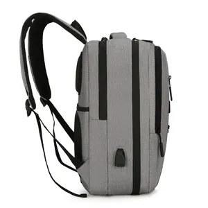 Gray large capacity travel business laptop backpack with USB charging port side view