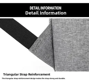 Detail of triangular reinforced stitching on gray fabric laptop backpack shoulder strap