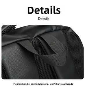 Close-up of reinforced top handle and breathable honeycomb mesh padding on black backpack