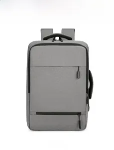 Gray business laptop backpack featuring a side handle and hidden front zipper pocket